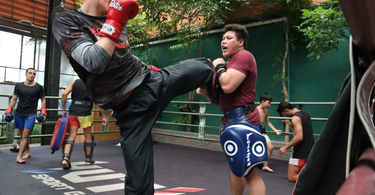 What to Look for in Muay Thai Sparring Gloves: Fit, Padding, and Protection